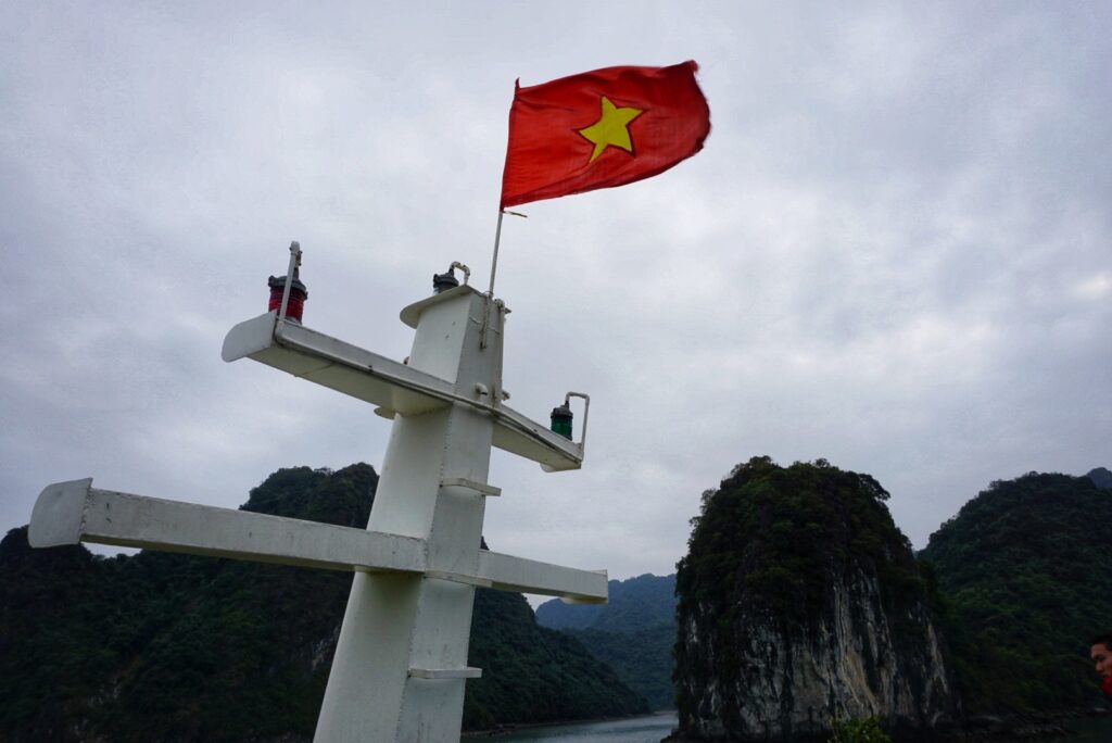 The Vietnam flag on a cruise boat in Halong Bay