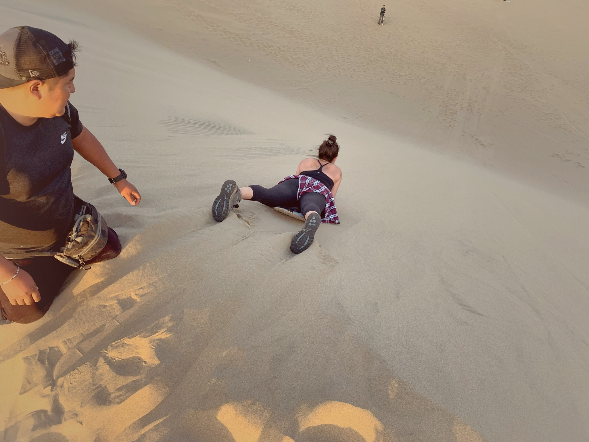 Sandboarding down the sand dunes is a fun activity to try while in Huacachina.