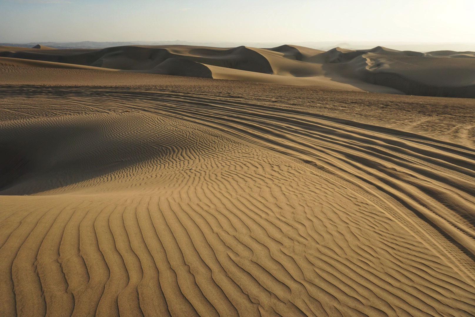 A view of the desert sand dunes in Huacachina, Peru.