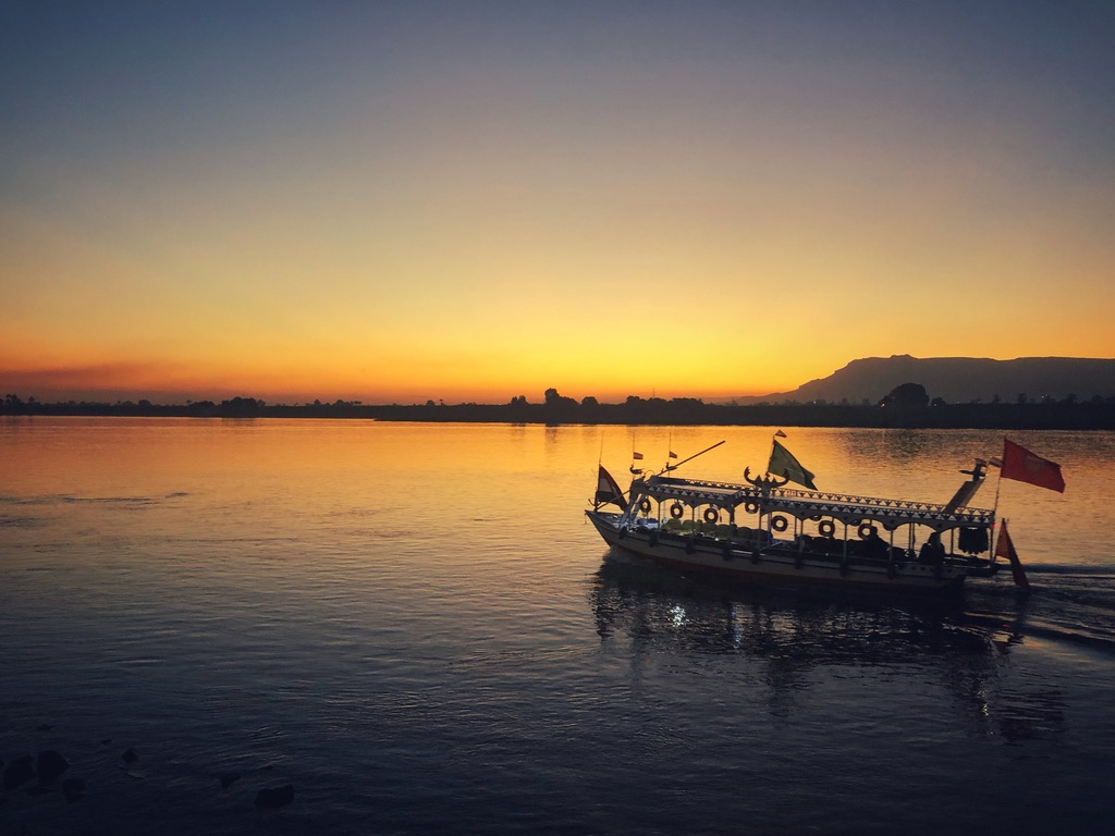 A boat on the Nile River at sunset