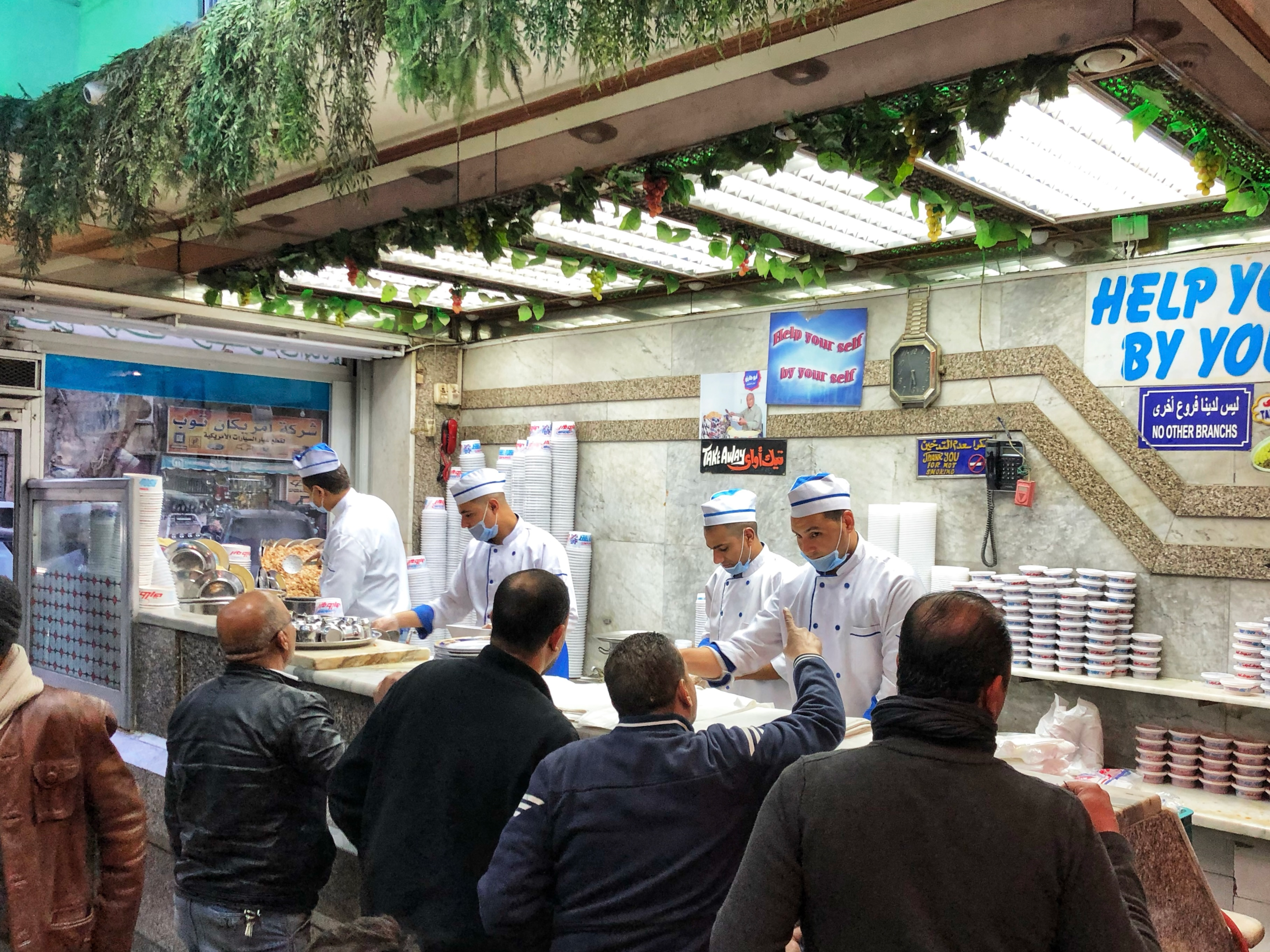 A busy restaurant serving koshary