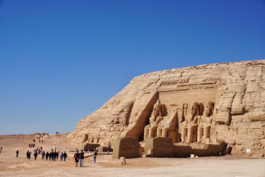 A far way view of the massive rock face of Abu Simbel