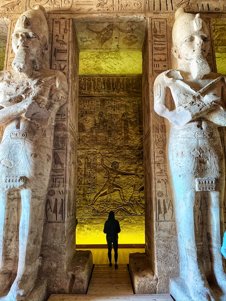 Standing between 2 large statues at Abu Simbel Temple