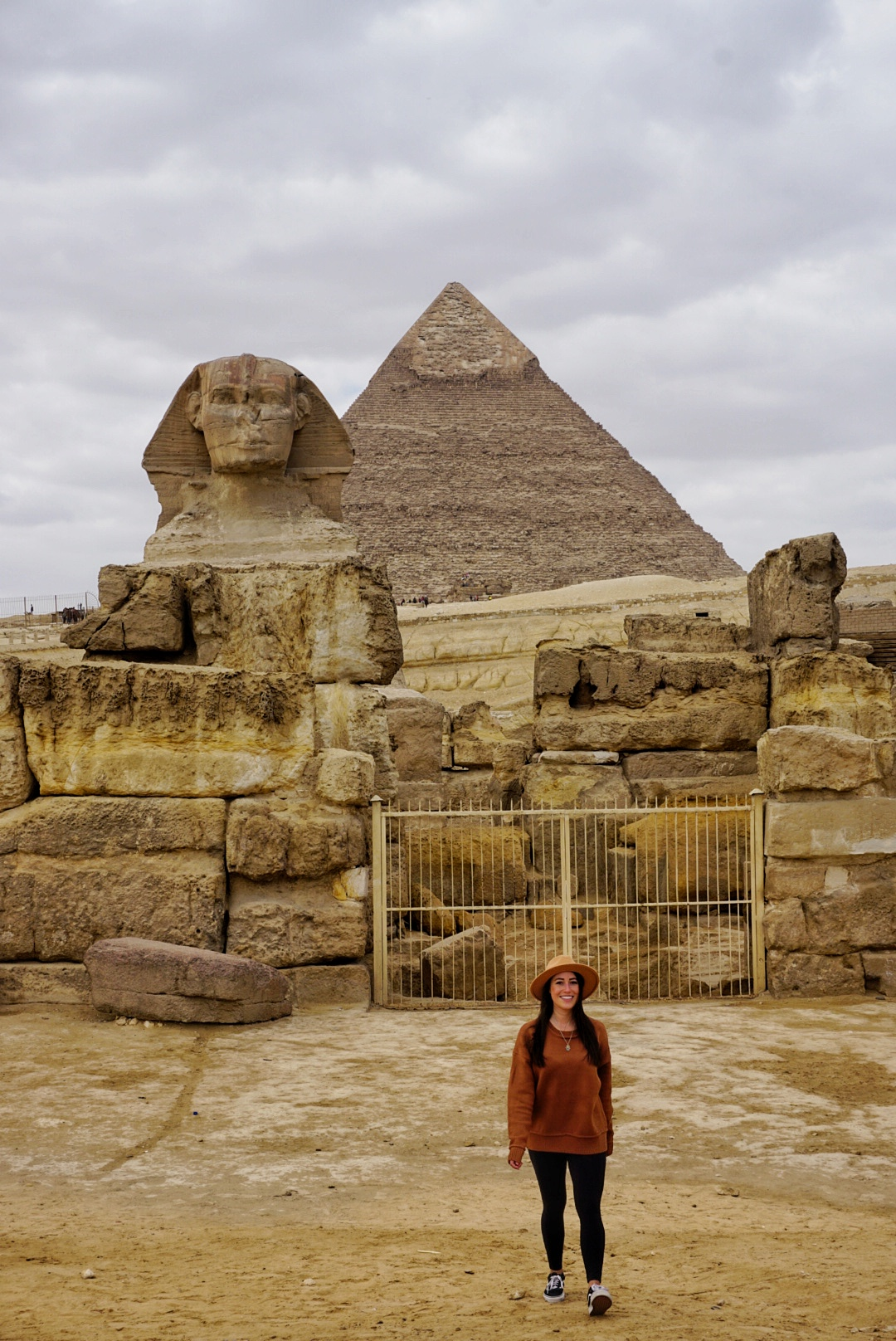 Walking in front of the Sphinx and a pyramid