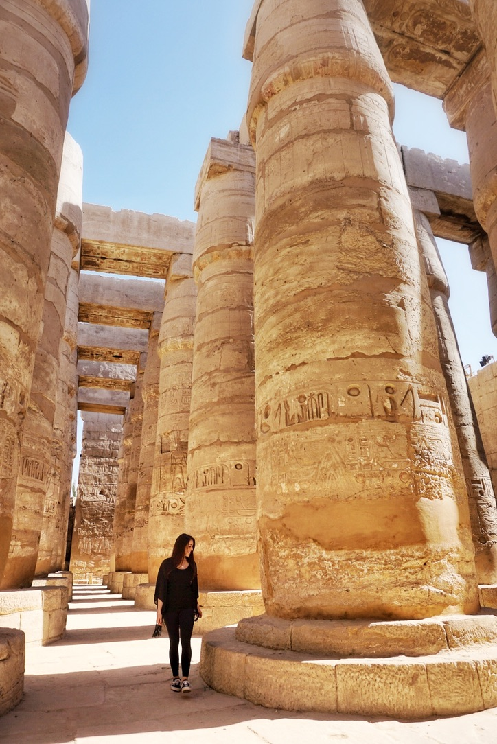 Walking through the massive columns at Karnak Temple
