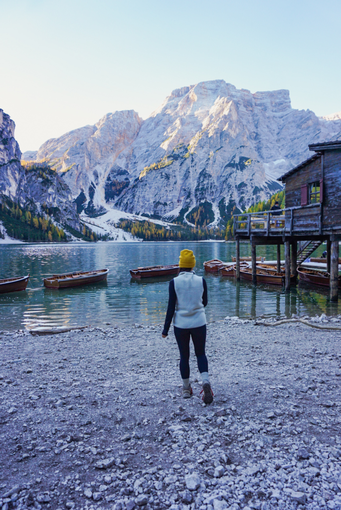 Lakeshore views of the boat house and the wooden row boats at Lago di Braies, Dolomites, Italy